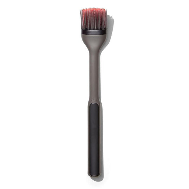 OXO Good Grips Basting Brush with silicone bristles and long handle for mess-free grilling and easy cleanup.