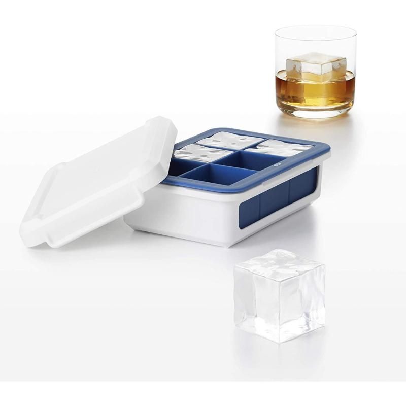 Large OXO Good Grips ice cube tray with flexible silicone, protective cover, and sturdy base, making uniform ice cubes easy to remove.