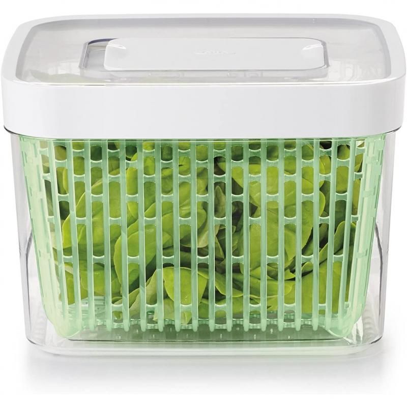 Clear container designed to keep fruits and vegetables fresh, features carbon filter, adjustable vent, and elevated colander.