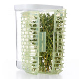 Compact OXO Greensaver Herb Keeper maintains herb freshness with moisture control and 360° air circulation.