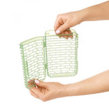 Compact herb keeper designed to extend freshness, featuring moisture management and easy-access hinged lid for herbs.