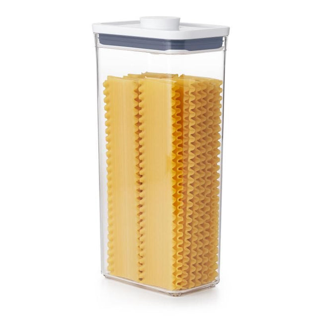 Transparent tall storage container with pop-open lid for airtight freshness, ideal for dry foods and kitchen organization.