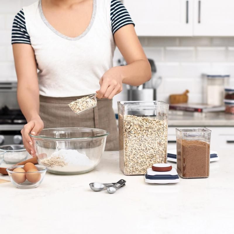 OXO Pop 2.0 Baking Set: 8-piece airtight storage containers with measuring scoops and brown sugar saver for organized baking.