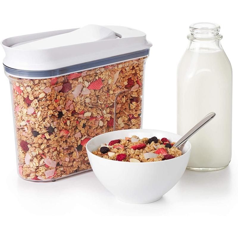 Clear OXO Good Grips cereal dispenser with pop-open lid and smooth-pour spout for easy, mess-free servings.