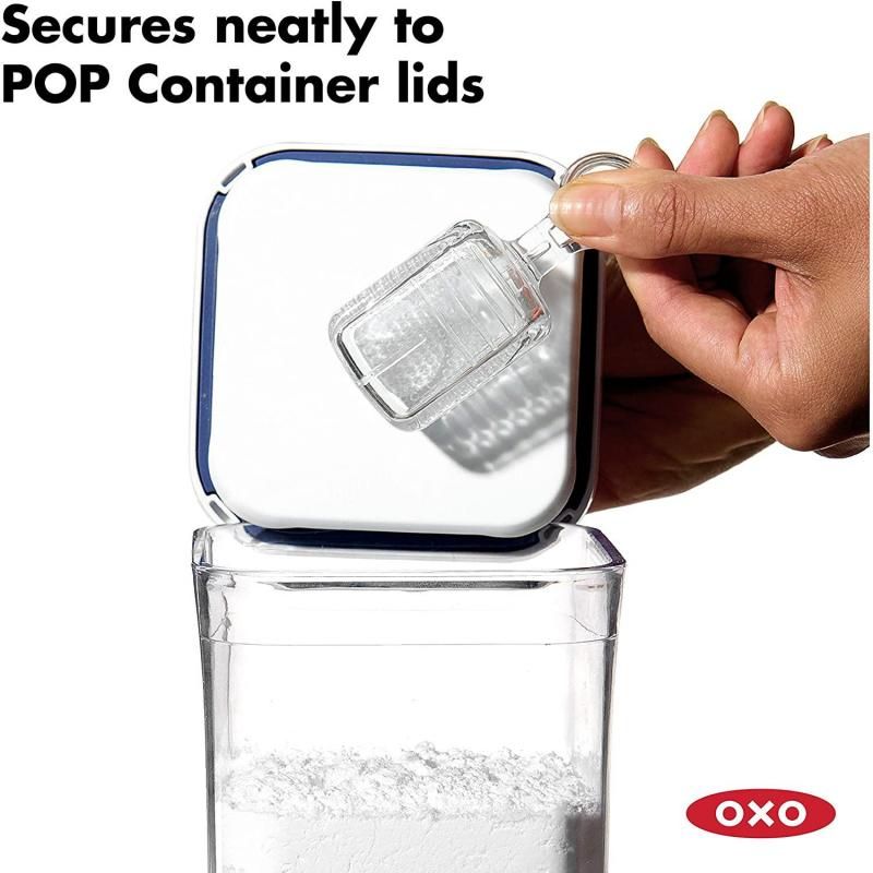 OXO Good Grips Pop Dusting Scoop, ideal for dusting flour and cocoa, attaches to OXO POP lids for tidy kitchen storage.