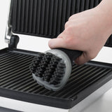 OXO Electric Grill & Panini Press Brush with flexible bristles and silicone wiper for easy, non-scratch cleaning.