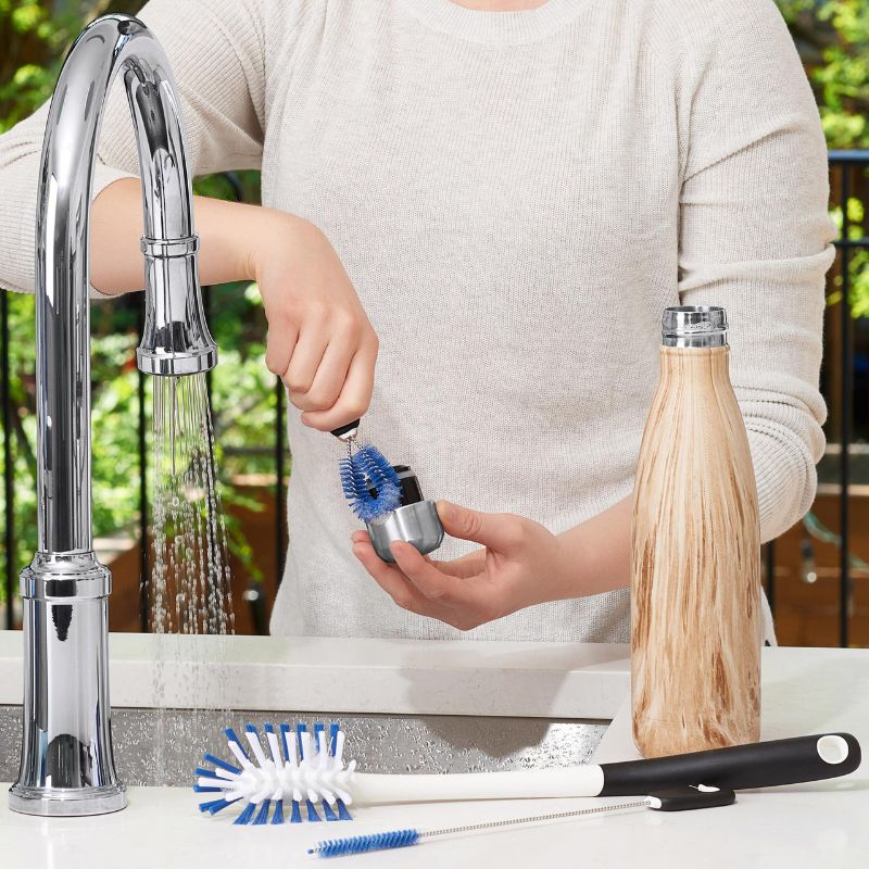 OXO Water Bottle Cleaning Set features a long bottle brush, straw brush, and detail cleaner for thorough bottle hygiene.