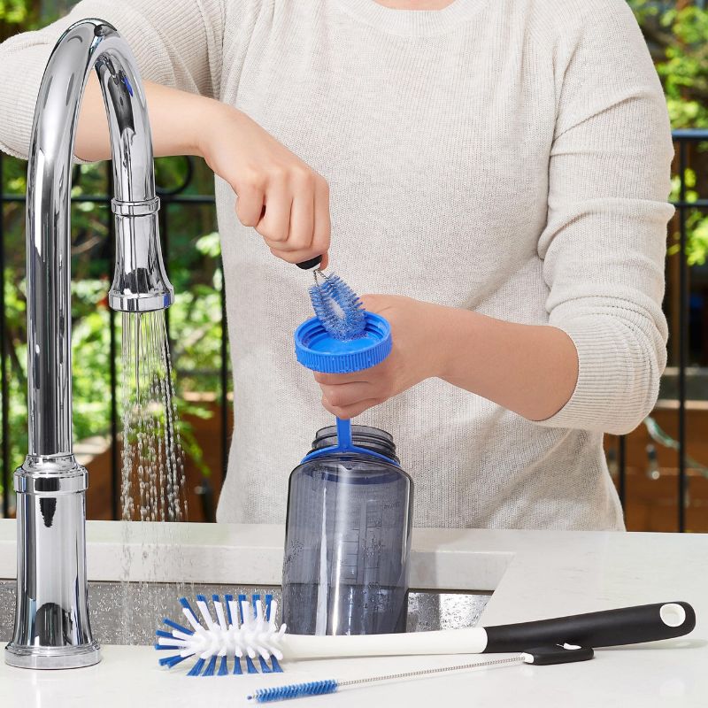 OXO Water Bottle Cleaning Set featuring a long brush, straw brush, and detail cleaner for thorough hydration gear hygiene.