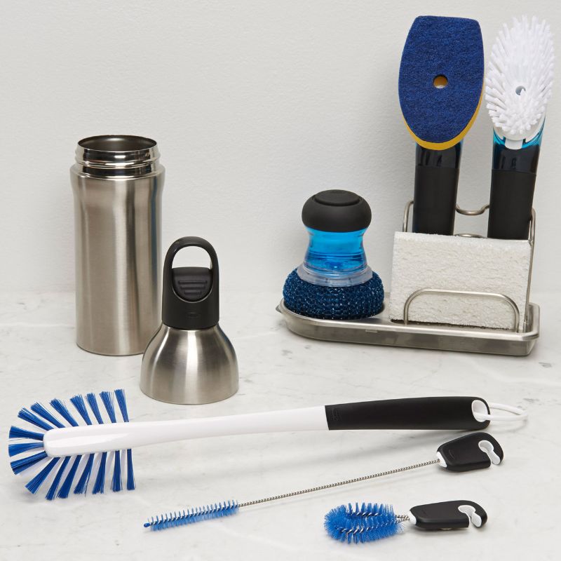 OXO Water Bottle Cleaning Set featuring long bottle brush, straw brush, and detail cleaner for thorough and germ-free hydration gear.