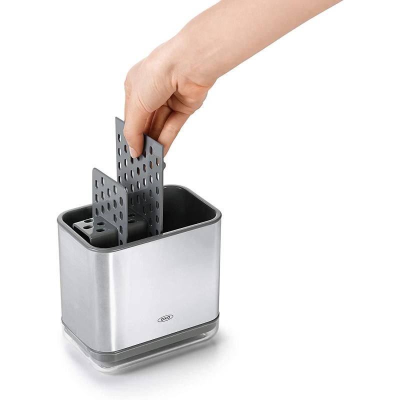 Sleek stainless steel sink caddy with divider for organized cleaning tools, featuring ventilation and drip tray for efficient drying.