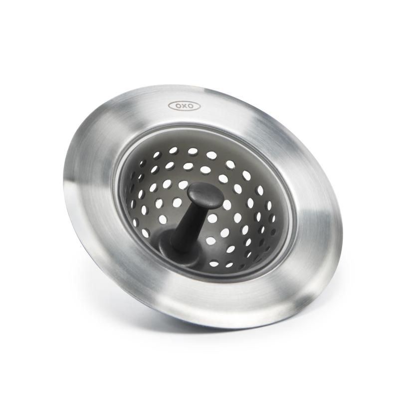 OXO Good Grips Silicone Sink Strainer features stainless steel and silicone for trapping food scraps and preventing clogs.