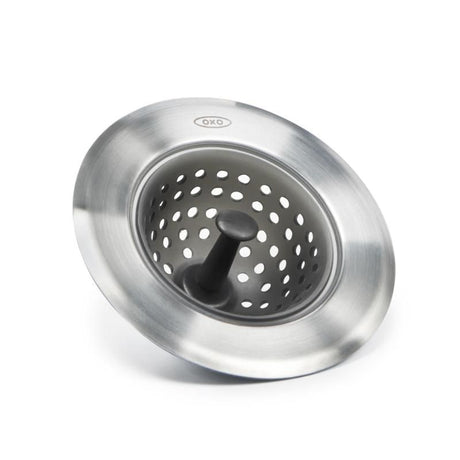 OXO Good Grips Silicone Sink Strainer features stainless steel and silicone for trapping food scraps and preventing clogs.