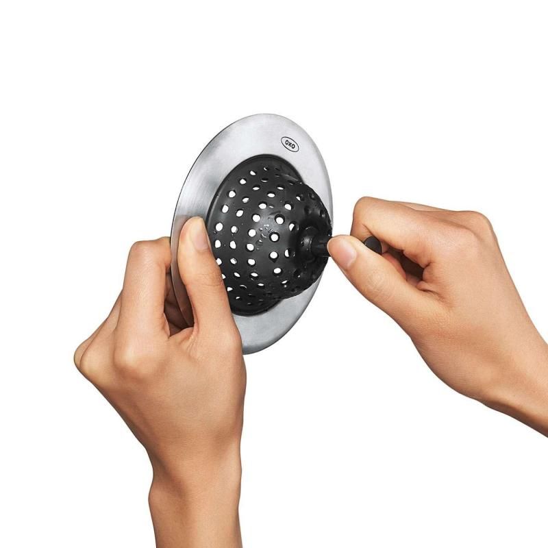 Sleek silicone sink strainer with stainless steel, traps food scraps, easy to clean, and protects sink from scratches.