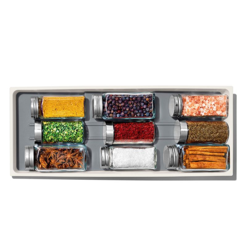 Compact spice drawer organiser with tiered design for visibility, non-slip feet, and removable tray for easy cleaning.