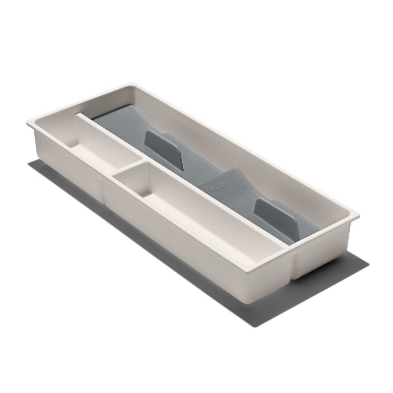 Compact utensil organizer with divided sections, non-slip feet, and removable tray for neat kitchen storage.