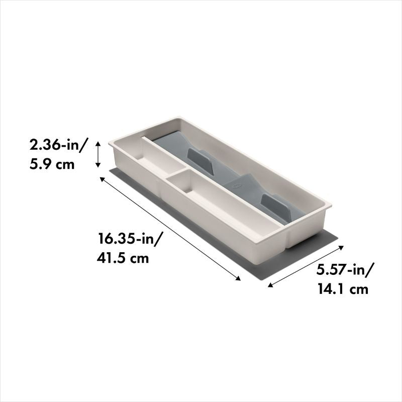 Compact utensil organizer with divided sections and non-slip feet for small kitchen drawers, promoting neat and accessible storage.