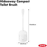 Compact toilet brush with a hygienic canister that opens automatically, featuring a comfortable handle and durable bristles.