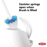 Compact toilet brush with automatic canister door, ergonomic grip, and durable bristles for hygienic and thorough cleaning.