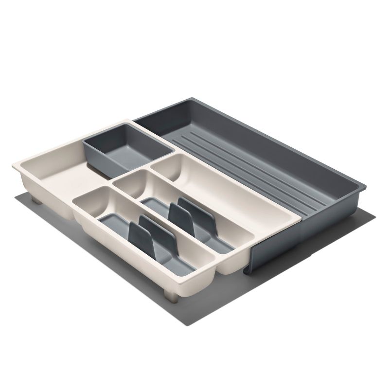 Expandable utensil drawer organizer with removable cups and non-slip feet for efficient kitchen storage and organization.