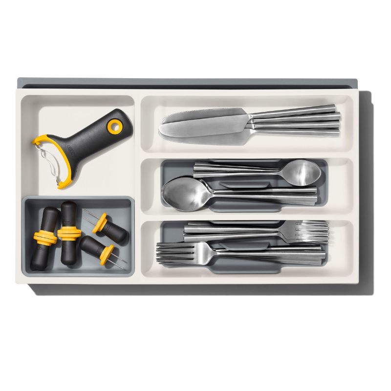 Expandable utensil drawer organiser with removable cup and non-slip feet, perfect for decluttering kitchen tools.