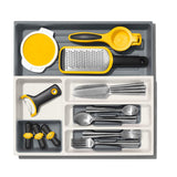 Expandable kitchen utensil drawer organiser with removable cup and non-slip feet for effective storage and easy access.