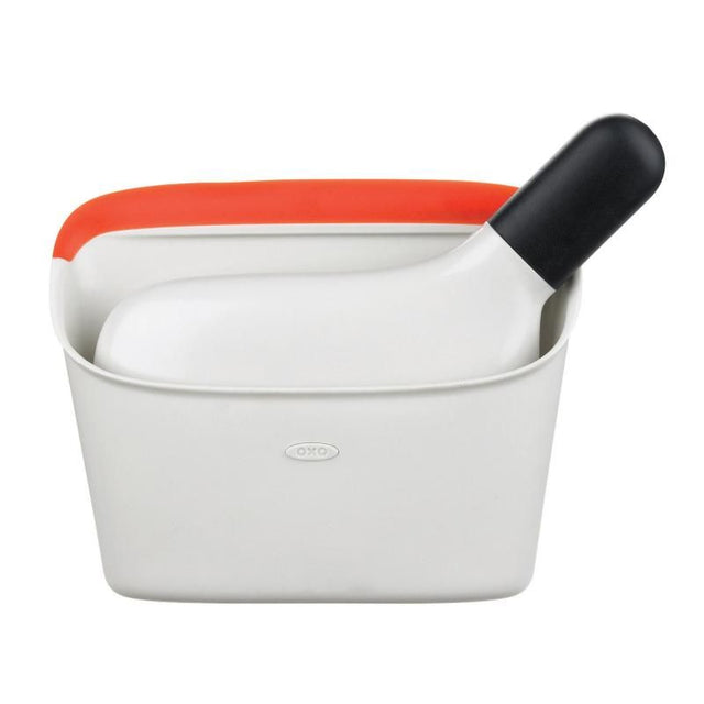 Compact dustpan and brush set with a rubber lip for efficient cleaning, ideal for small messes in tight spaces.