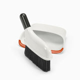 Compact dustpan and brush set with snap-in storage, soft rubber lip for efficient clean, and angled handle for easy use.