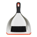 Ergonomic OXO Good Grips Dustpan & Brush Set with whisk-broom design for easy sweeping and storage, perfect for effective cleaning.