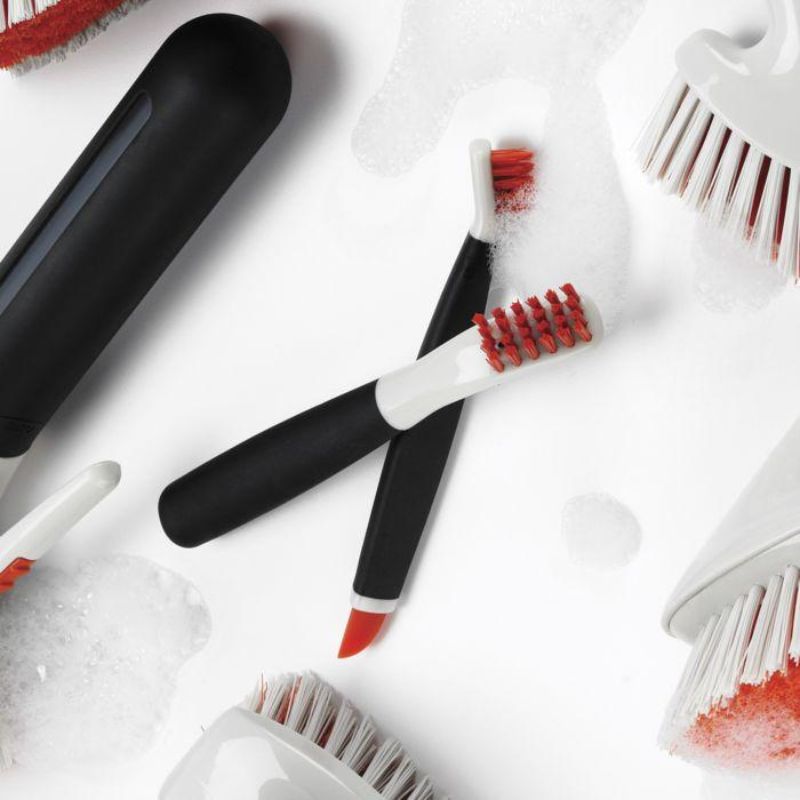 Image of OXO Good Grip Deep Clean Brush Set featuring large and small brushes designed for effective scrubbing and cleaning tight spaces.