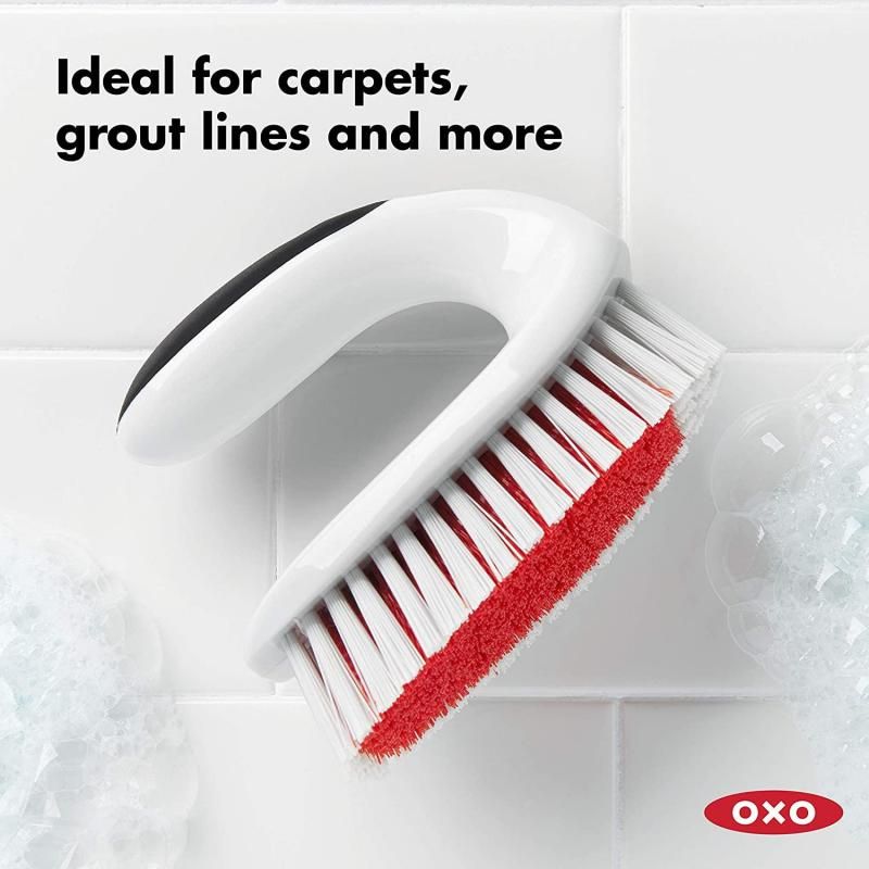 OXO Good Grips ALL-PURPOSE Scrub Brush with ergonomic handle and dual bristles for effective cleaning on various surfaces.