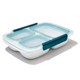 Leakproof OXO Good Grips 0.9L divided container for meal prep, featuring two compartments, eco-friendly design, and stay-cool handles.