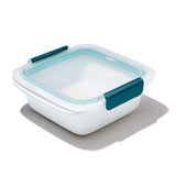 Clear OXO Good Grips sandwich container with leakproof lid, designed for tall sandwiches and easy fridge visibility.