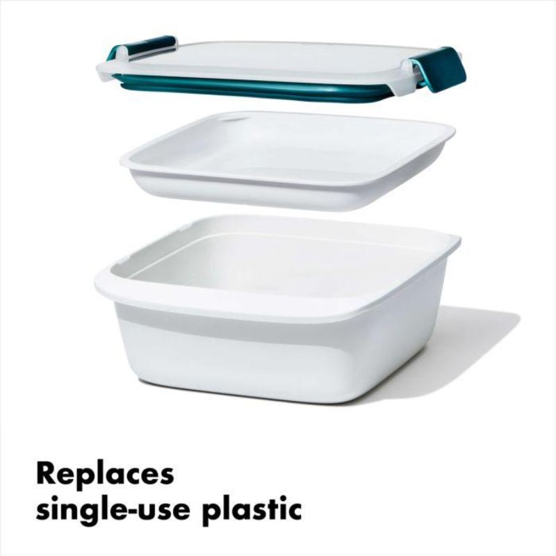 Watertight OXO Good Grips 1.5L salad container with separate tray, locking clips, and BPA-free design for fresh meals on the go.