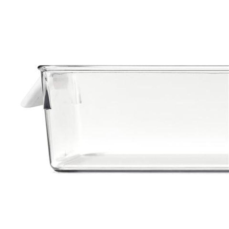 Clear OXO refrigerator storage bin for organizing fruits, vegetables, and meal prep essentials; smooth base for easy gliding.