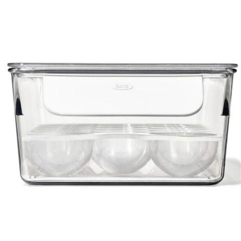 Clear OXO Refrigerator Egg Bin with removable tray, holds 20 eggs, easy access, hygienic design, BPA-free materials.