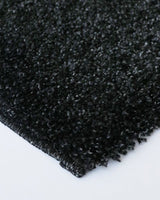 Stirling Floor Rug in Black Fleck 200x290cm, featuring a soft shaggy texture, durable polypropylene, ideal for modern decor.