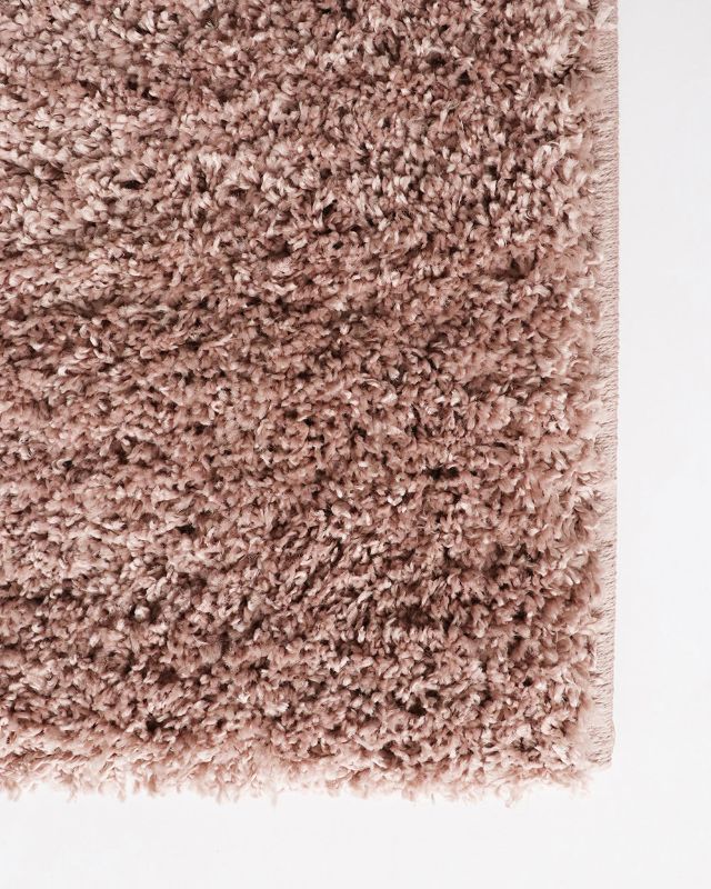 Shaggy almond-colored floor rug (200x290cm) offering softness and durability for modern homes.