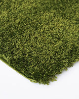 Shaggy almond rug measuring 200x290cm, soft polypropylene material for comfort, perfect for modern and traditional homes.