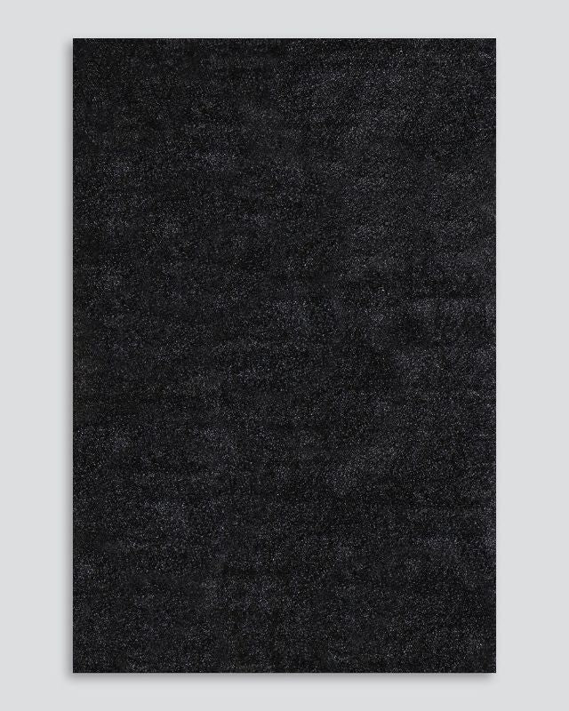 Soft almond shaggy rug measuring 200x290cm, perfect for adding warmth and elegance to any modern or traditional home.