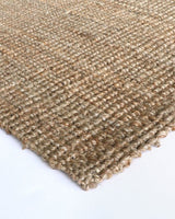 Handwoven jute rug in natural tones, 250x350cm, perfect for adding rustic charm to contemporary interiors.