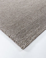 Handwoven 160x230cm Cyrus Floor Rug in earthy tones, featuring a textured knot-style weave for comfort and style.