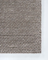 Handwoven Cyrus Floor Rug in Earth tones, 160x230cm, featuring a textured knot weave of wool, cotton, and polyester.
