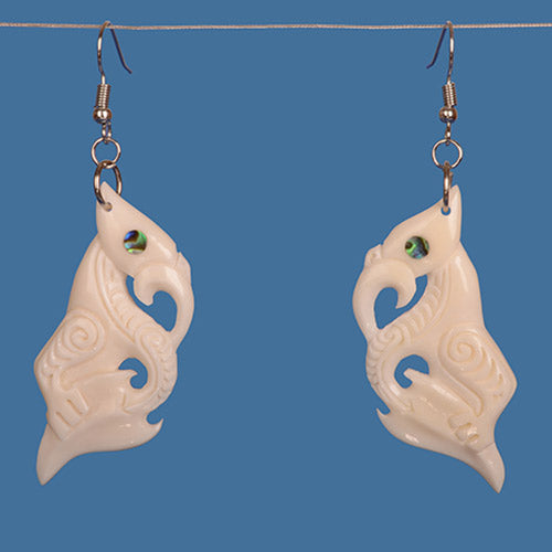 Manaia Bone Earring with paua shell accents, handcrafted from beef bone, symbolizing protection in Maori culture, 77mm drop.