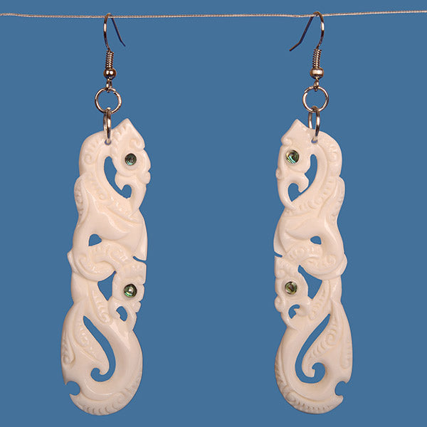 Elegant Double Manaia Bone Earrings with paua shell accents, symbolizing protection and safe travels, crafted from beef bone.