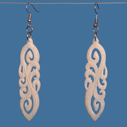 Handcrafted multi Koru bone earrings, featuring intricate Maori designs symbolizing new beginnings and family connection.