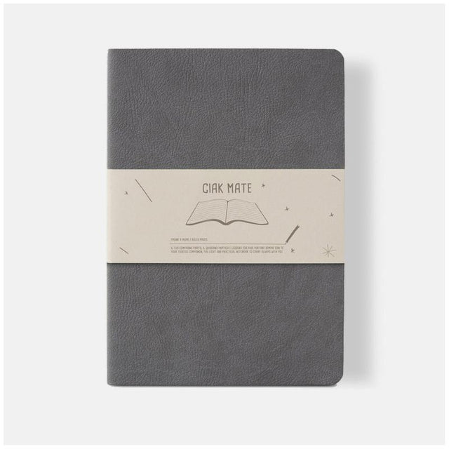 Soft grey A5 lined notebook with vegan leather cover, 64 cream pages, perfect for notes and sketches on the go.