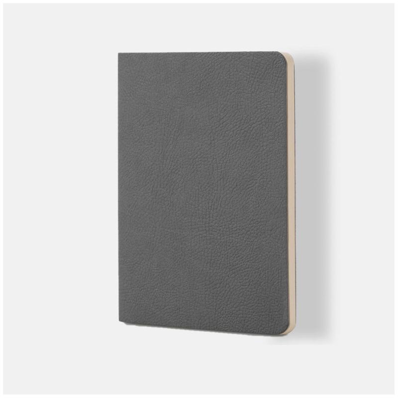 Soft grey A5 notebook with vegan leather cover and 64 lined cream pages, perfect for notes and sketches on the go.