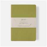 Vibrant lime A5 lined notebook with soft vegan leather cover, 64 cream-colored pages, perfect for notes and journaling.