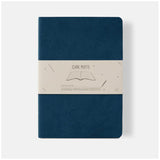 Ciak Mate A5 lined notebook in blue with soft vegan leather cover and 64 cream pages for elegant note-taking.