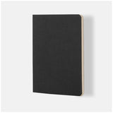 Elegant black A5 lined notebook with soft vegan leather cover, 64 cream-colored pages for smooth writing experience.